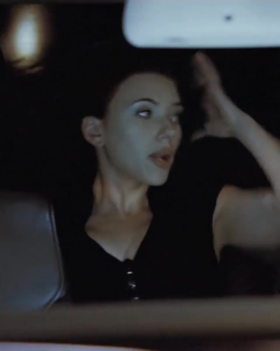 Scarlett Johansson stripping in the back of the car