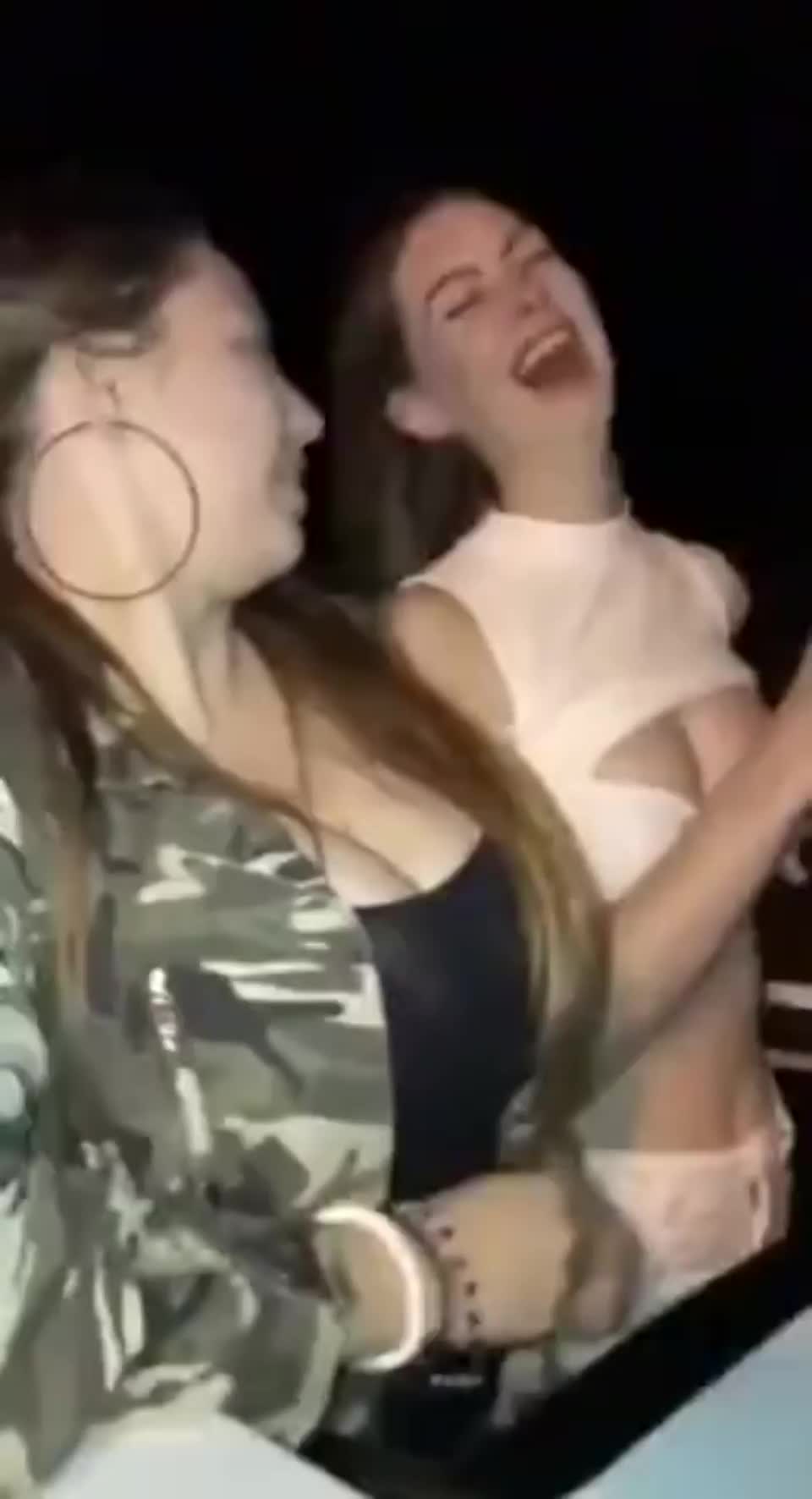 Two Girls Ride Roller Coaster And Show Their Tits