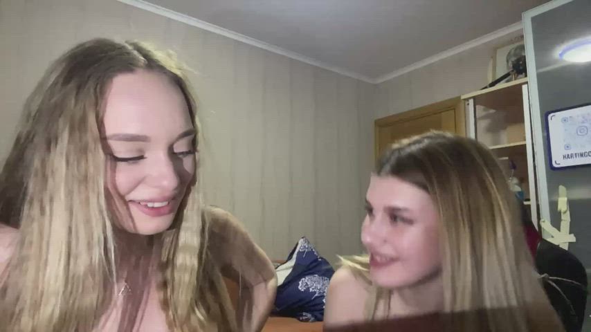 Two embarrassed girls flashing hot tits