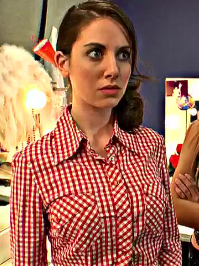 Alison Brie's shirt ripped open to show off her ample cleavage